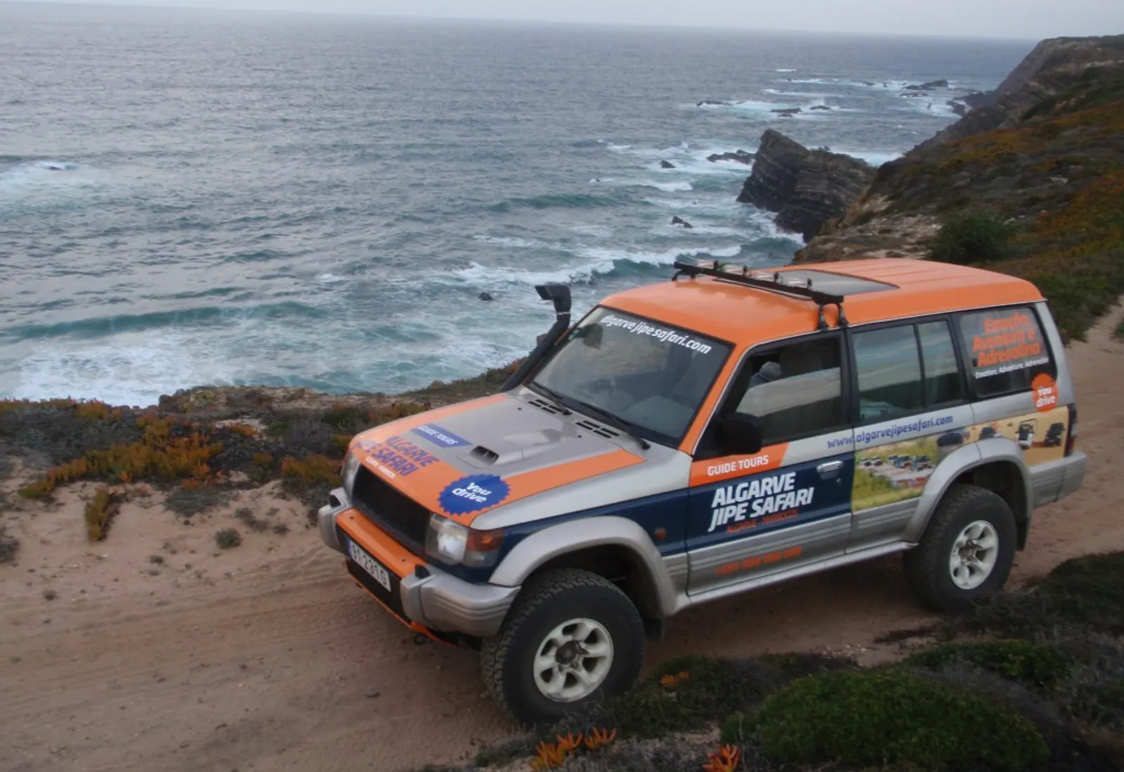 Orange Algarve Jipe Safari jeep above the Atlantic coast