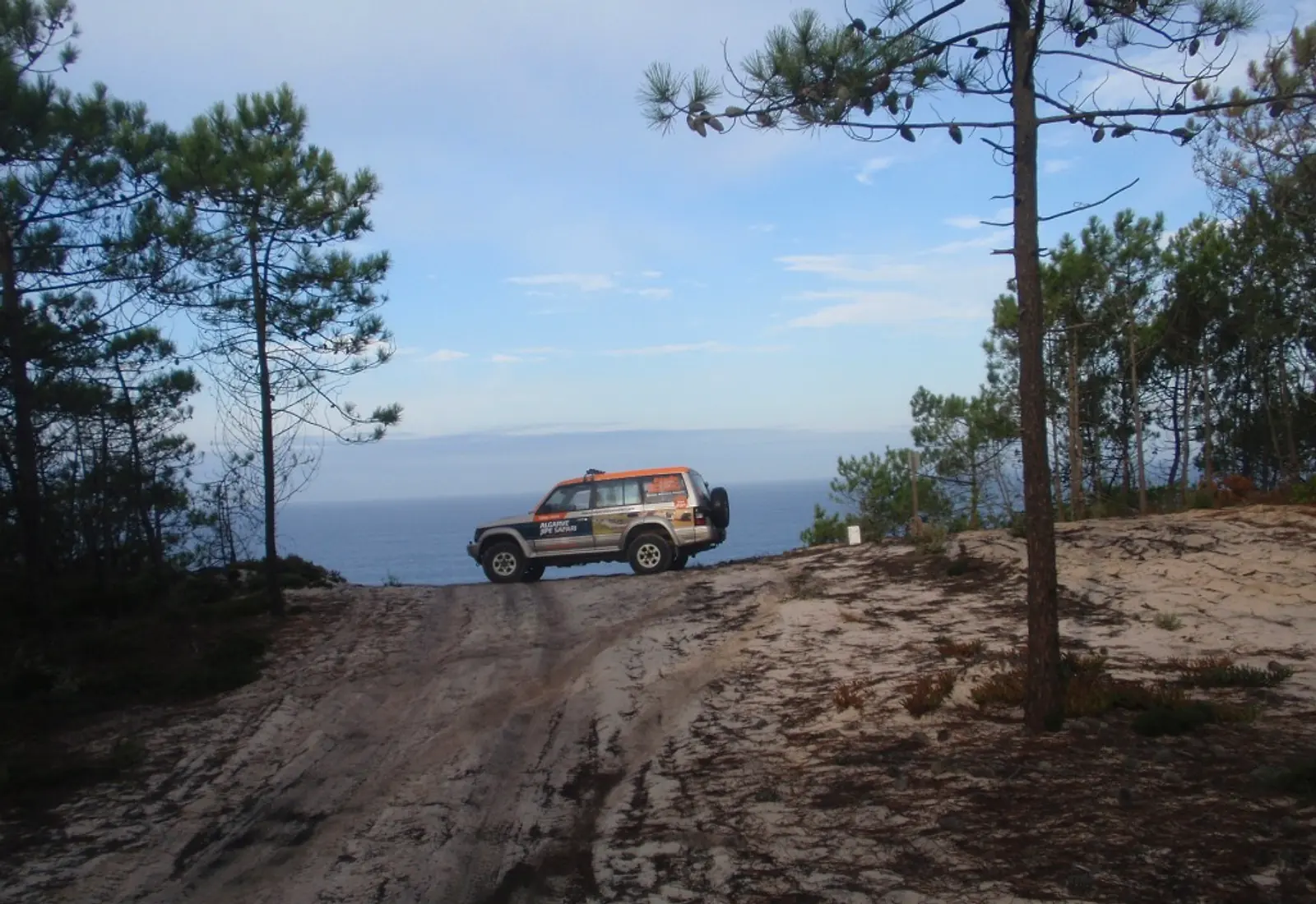 Orange jeep on an Algarve coastal track
